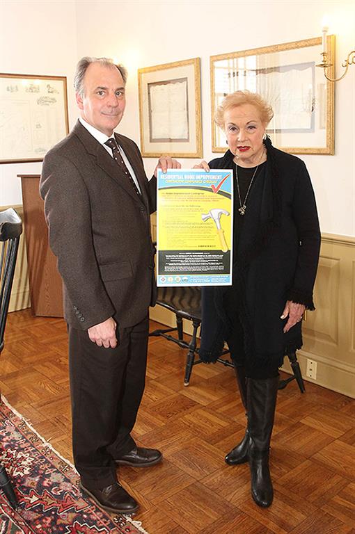 To mark Consumer Protection Week which runs from March 6 through March 12, Colts Neck Township Planner Timothy Anfuso and Freeholder Lillian G. Burry display the Residential Home Improvement Contractor Compliance Checklist that the Monmouth County Division of Consumer Affairs provided to Colts Neck and all municipalities in Monmouth County. 
